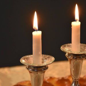 two candles on a table