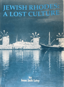 a book cover with windmills and a boat